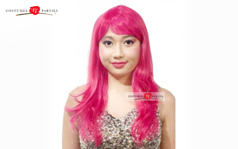 Woman wearing a long hot pink wig.